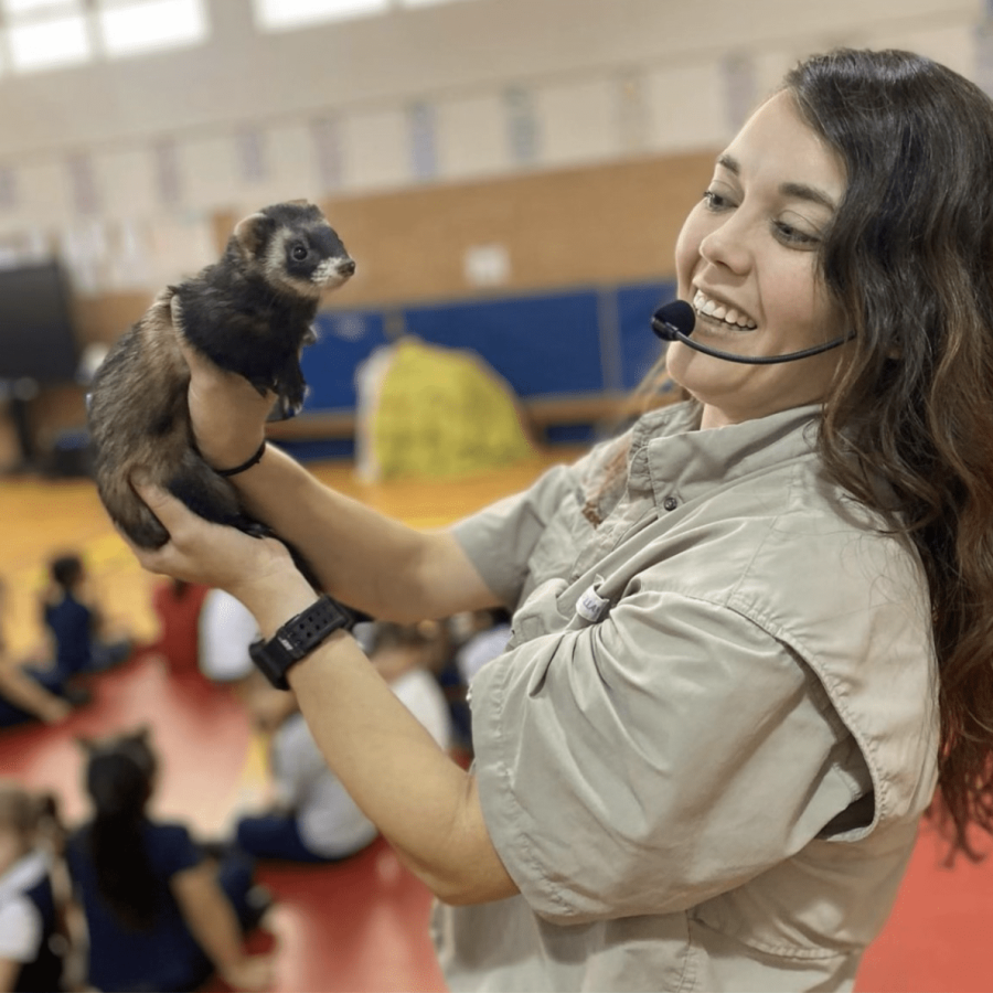 The Creature Teacher holding a ferret