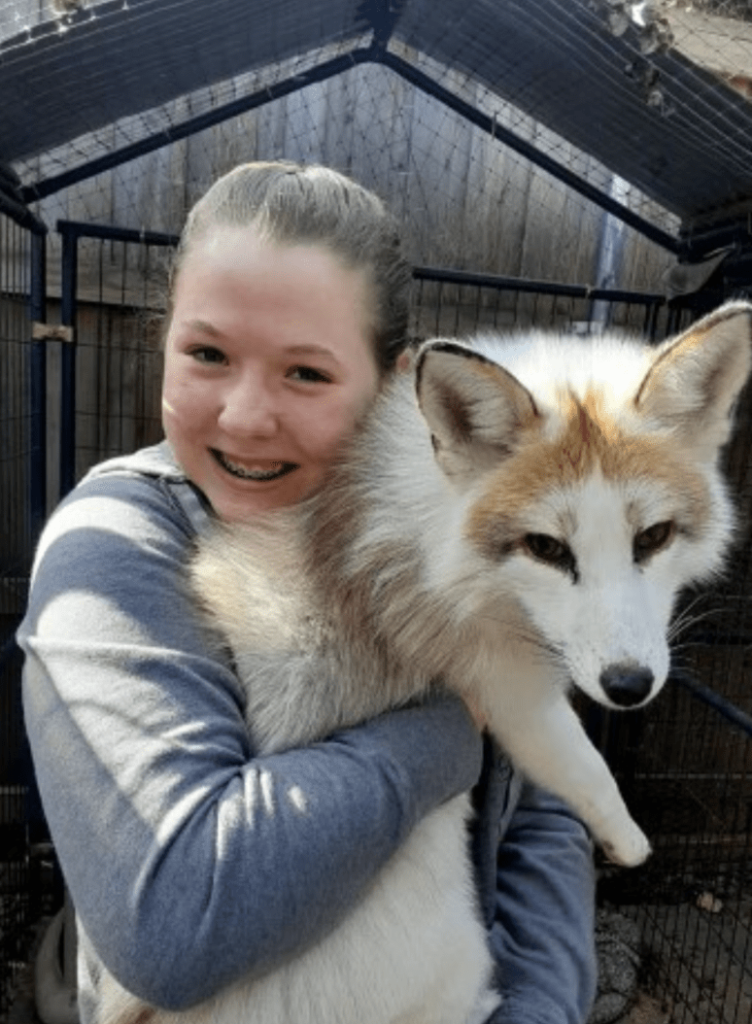 The Creature Teacher holding a fox