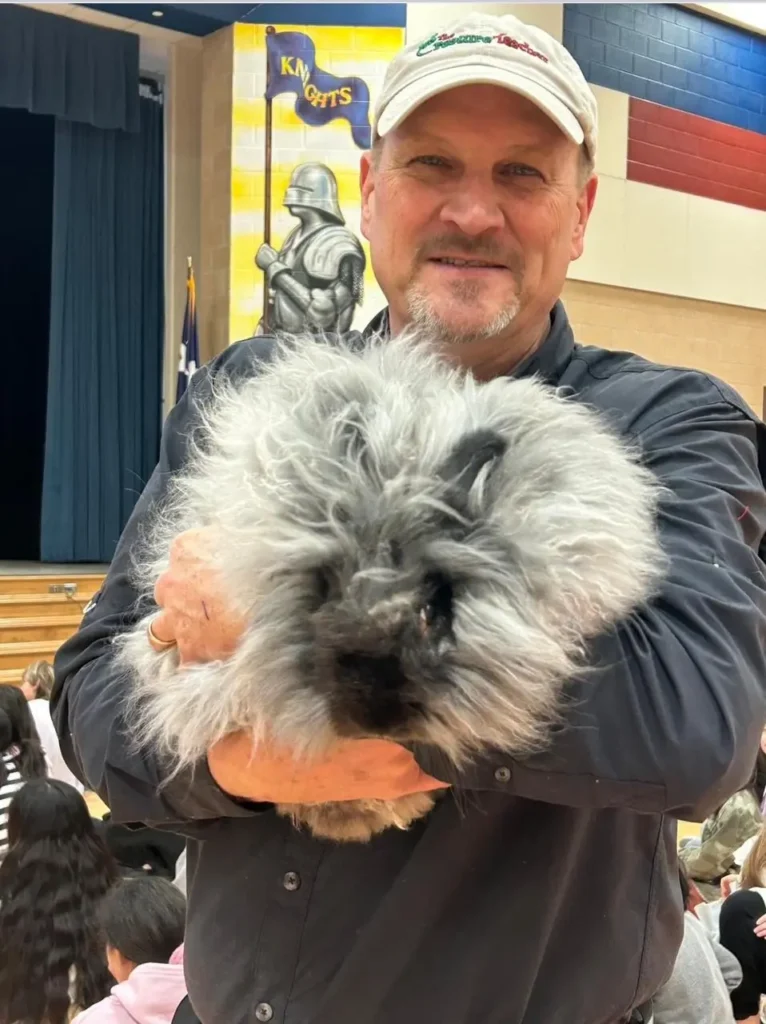 The Creature Teacher holding a rabbit