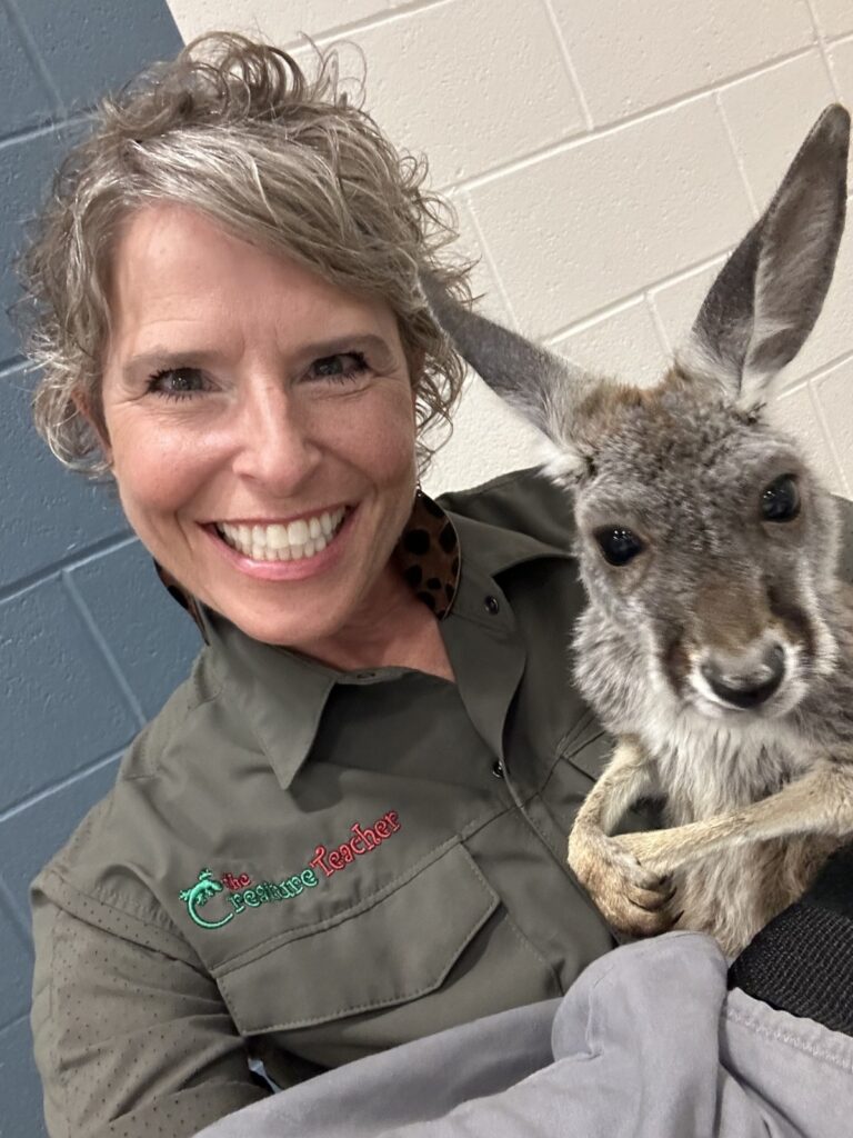 Creature Teacher with kangaroo while at a school program