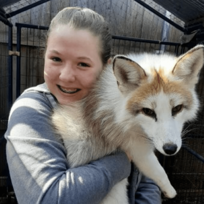 The Creature Teacher Instructor hugging a fox