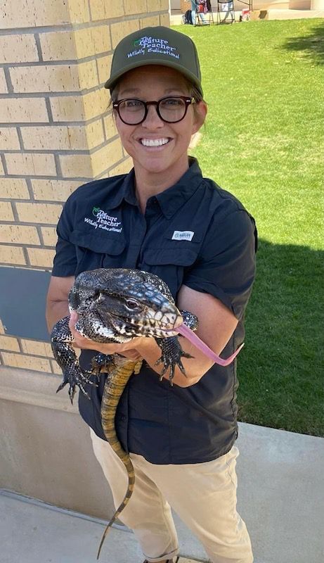 The Creature Teacher in Tyler location, smiling with a tegu