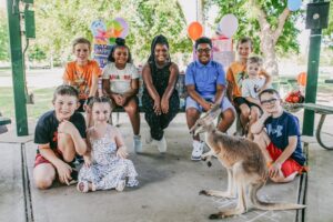 Children smiling at a live birthday party