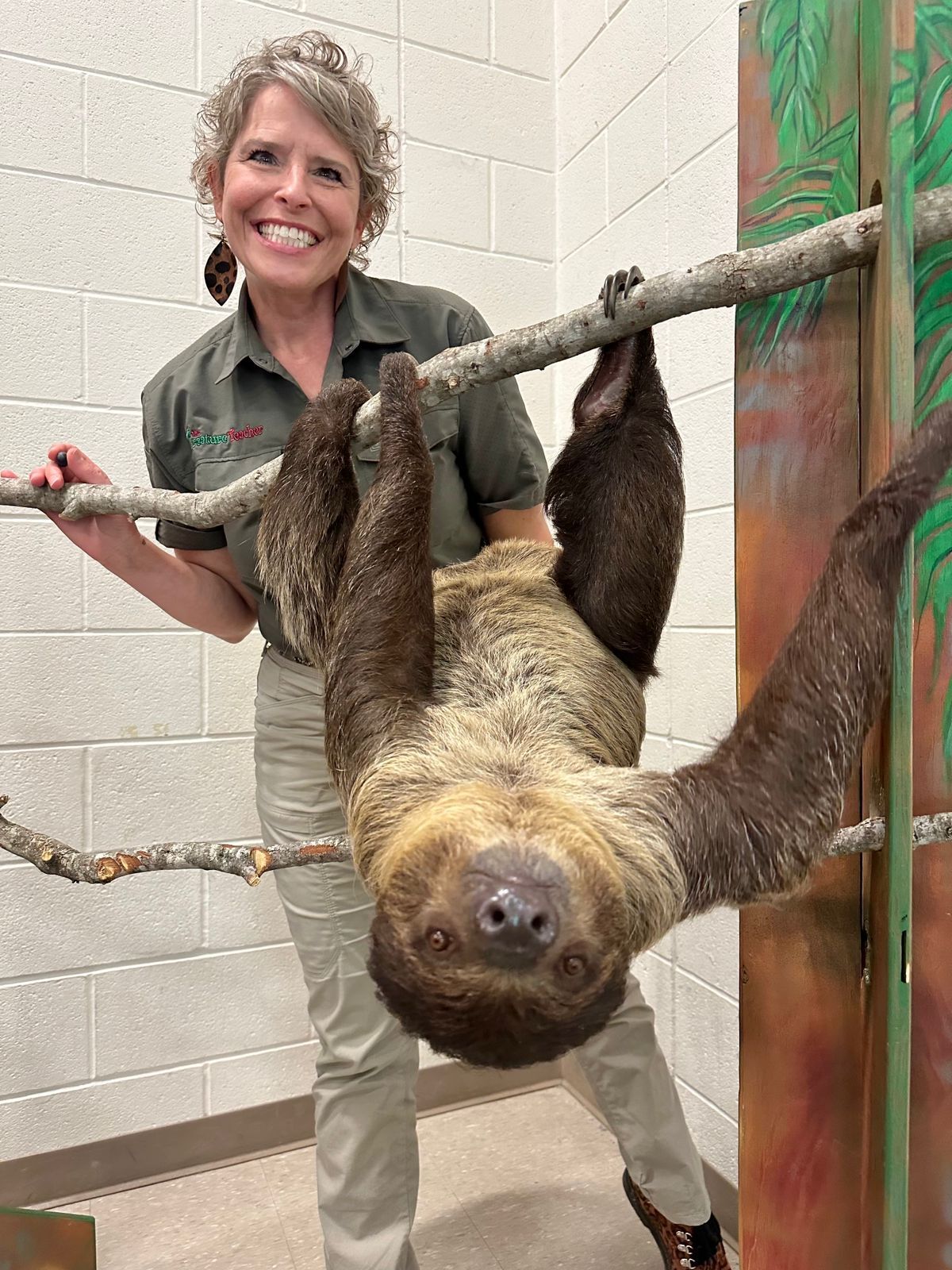 The Creature Teacher and Dezzi the sloth at an educational school program